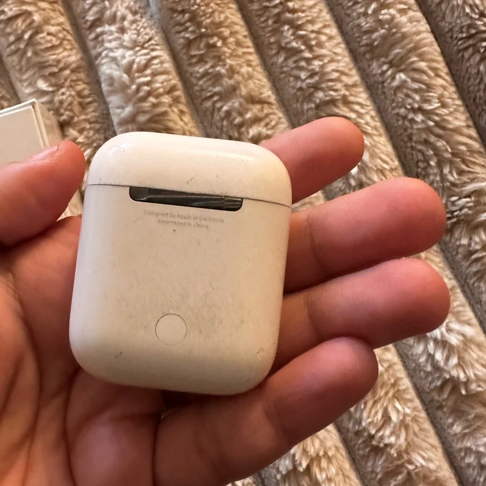 (1) brand new AirPods (1) second hand AirPods total of 2